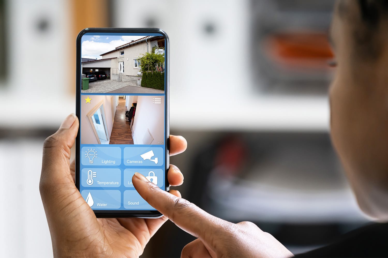 A woman managing her smart home devices from her smart phone.