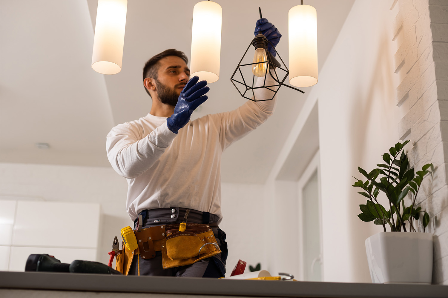 An electrician improving the home value of a Tennessee home by adding LED lighting.